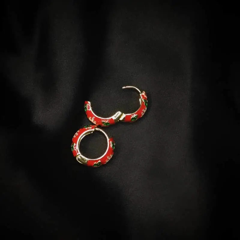Red Enamel Hoop Earrings with pink and green floral design