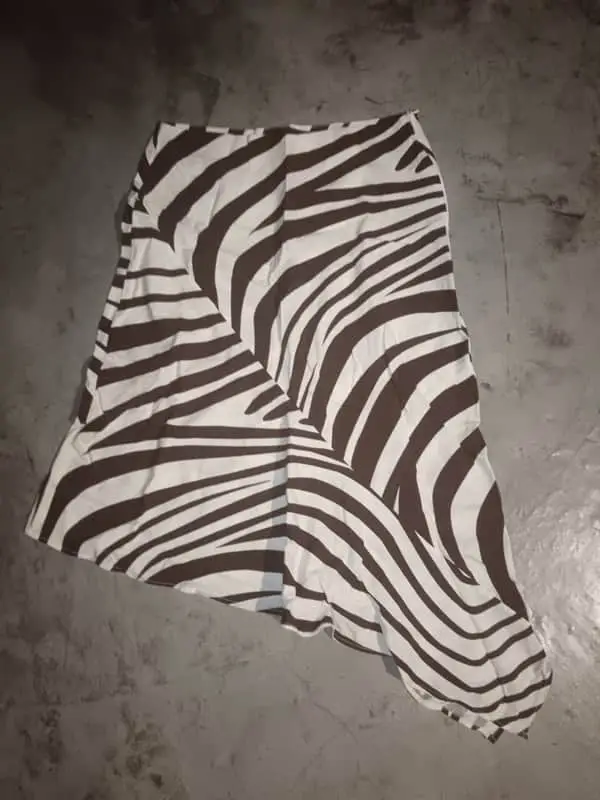 None. brown zebra print asymmetrical midi skirt