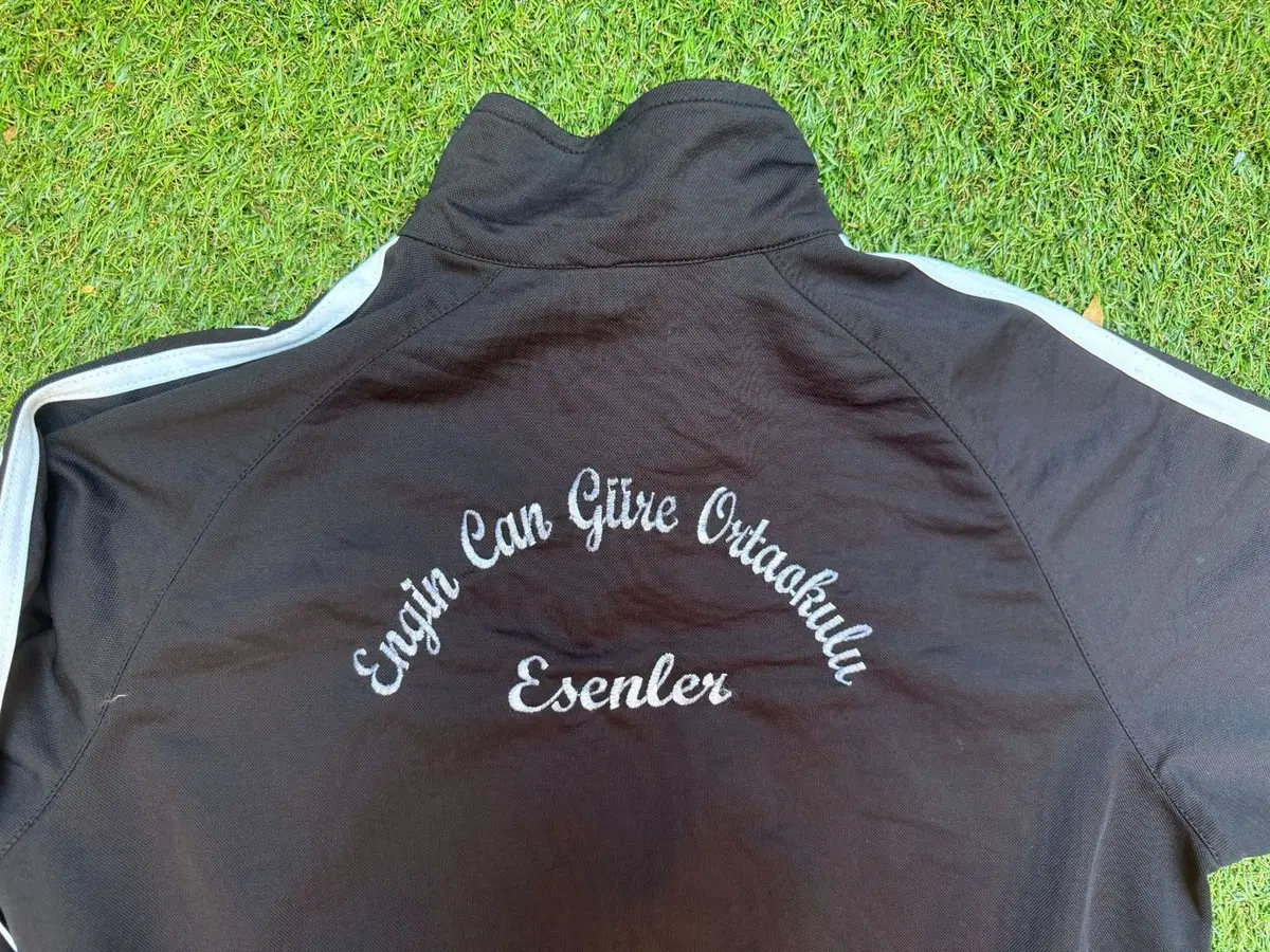 Black Track Jacket with White Sleeve Stripes