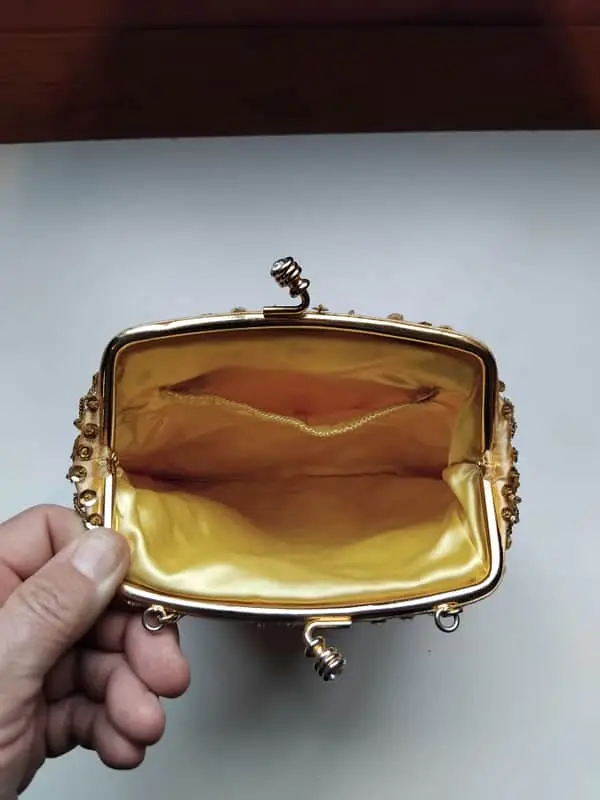 Gold satin evening bag with sequined detail