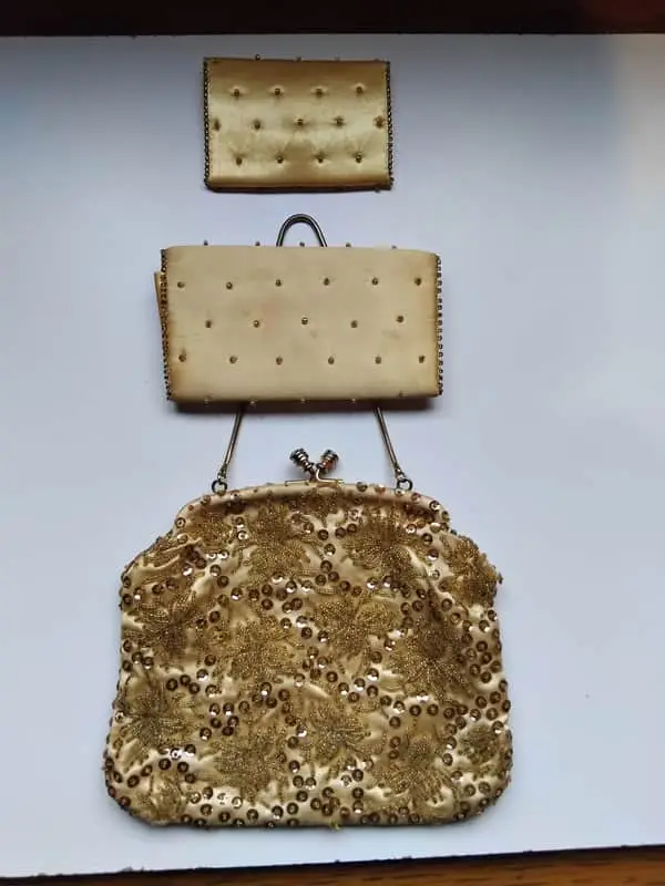 Gold satin evening bag with sequined detail
