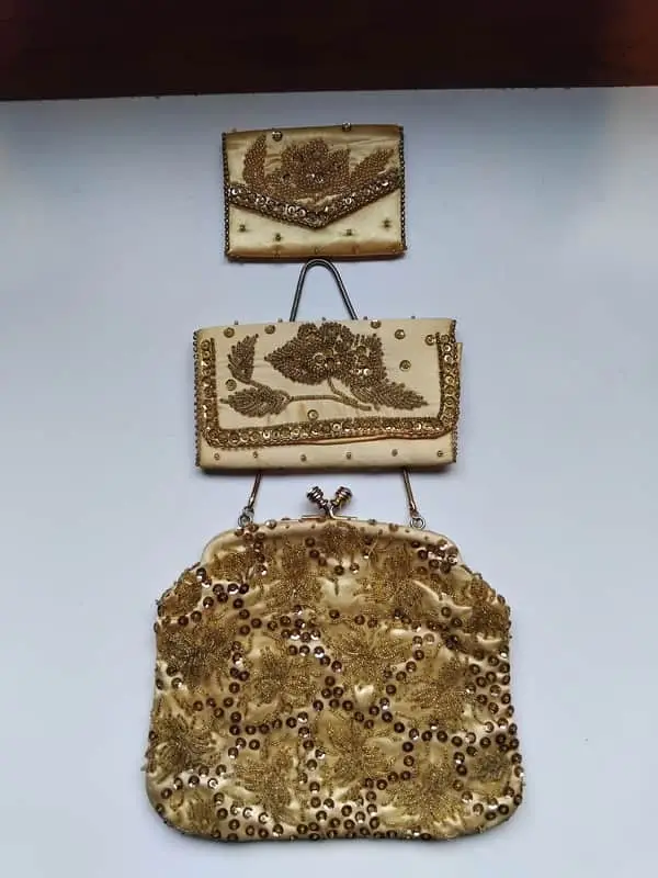 Gold satin evening bag with sequined detail