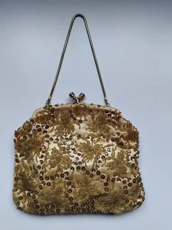 Gold satin evening bag with sequined detail