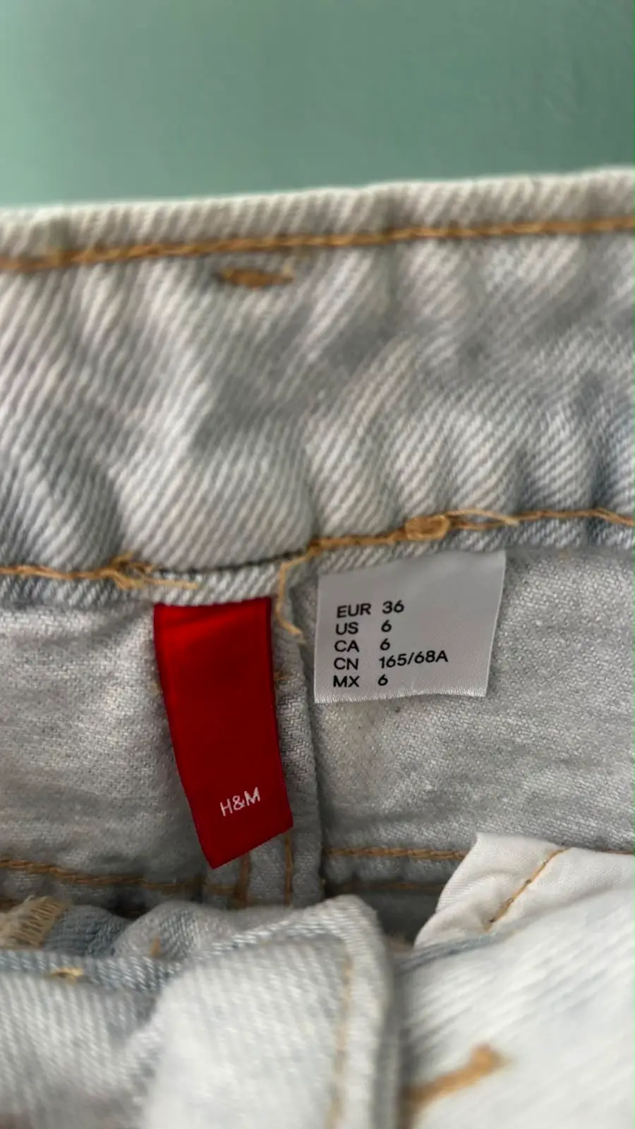 H&M Light-Wash Distressed Denim Cheeky Shorts