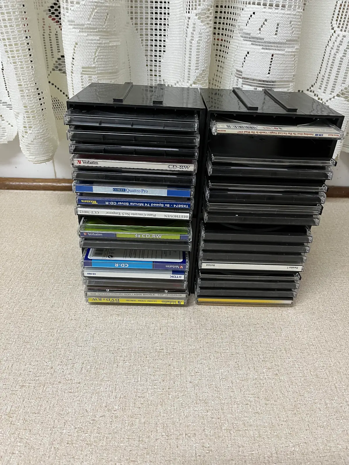 CD RACKS SET OF FOUR . Empty 32 CD covers also