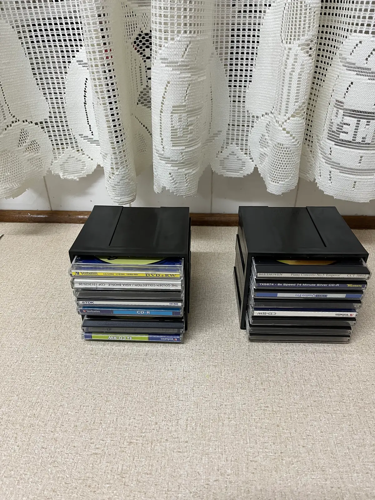 CD RACKS SET OF FOUR . Empty 32 CD covers also