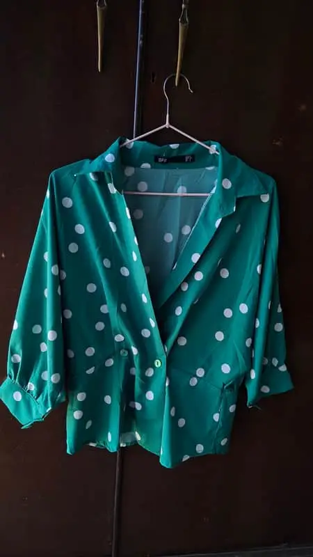 Vibrant emerald green and white polka dot blouse