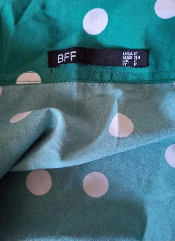 Vibrant emerald green and white polka dot blouse