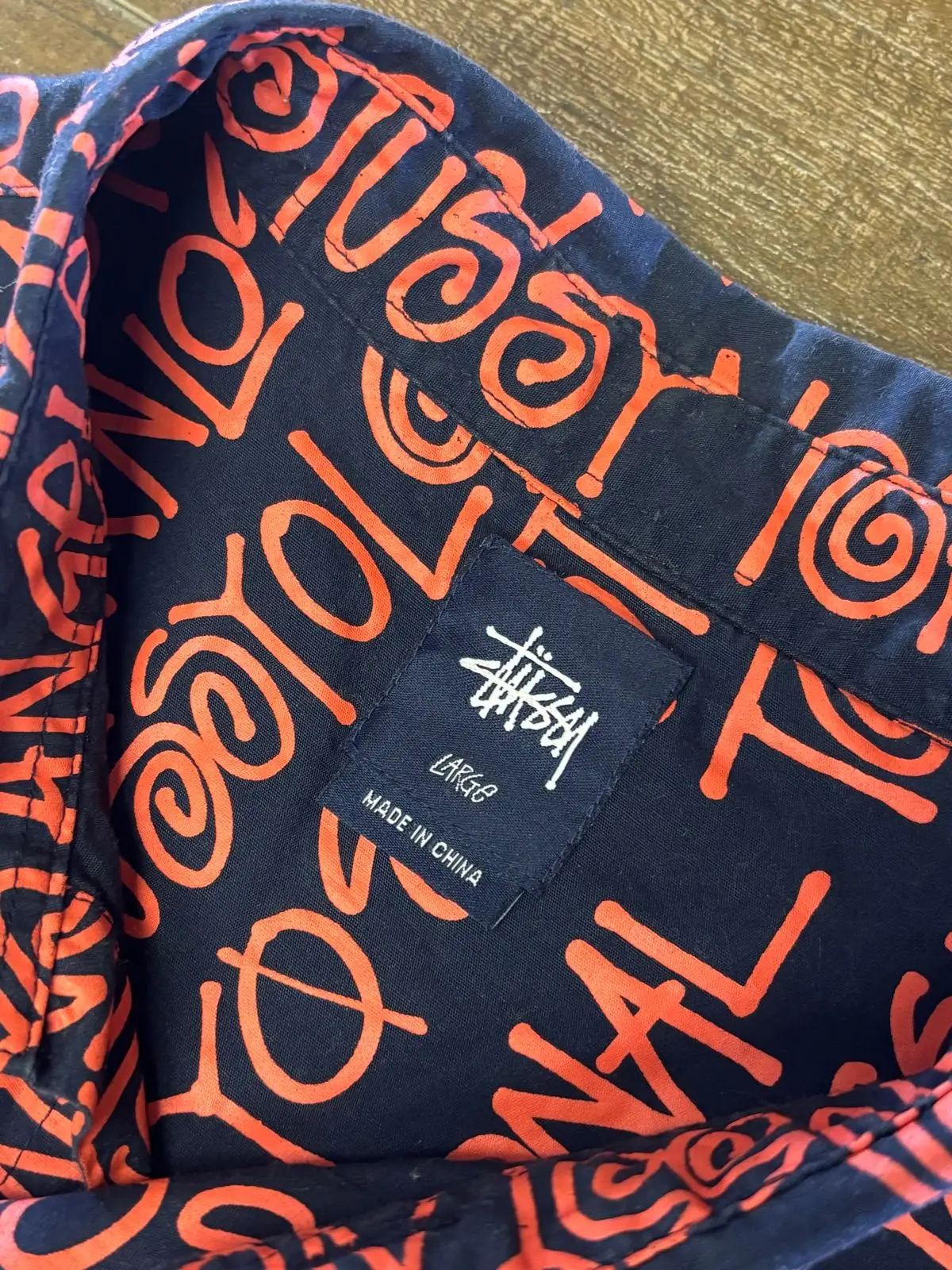 Stüssy Navy Orange All-Over Text Print Long-Sleeve Shirt