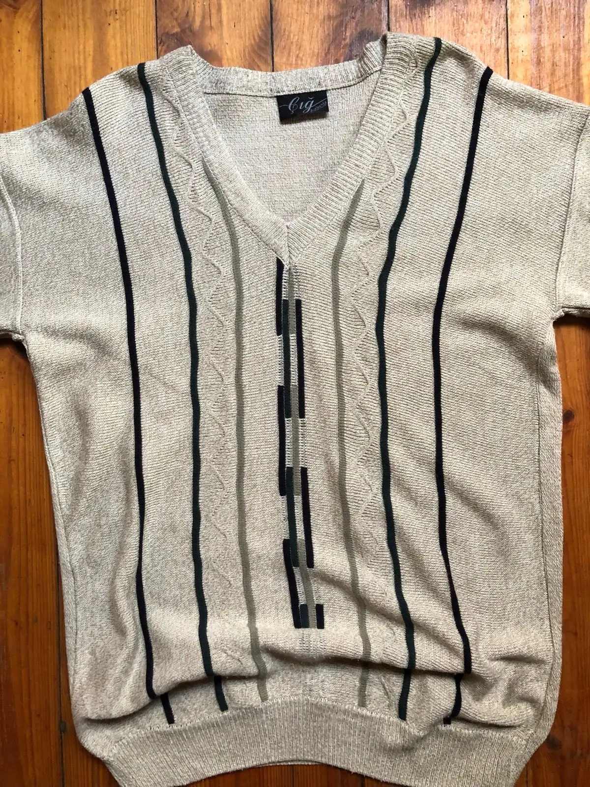 Cream V-Neck Sweater with Black Geometric Pattern