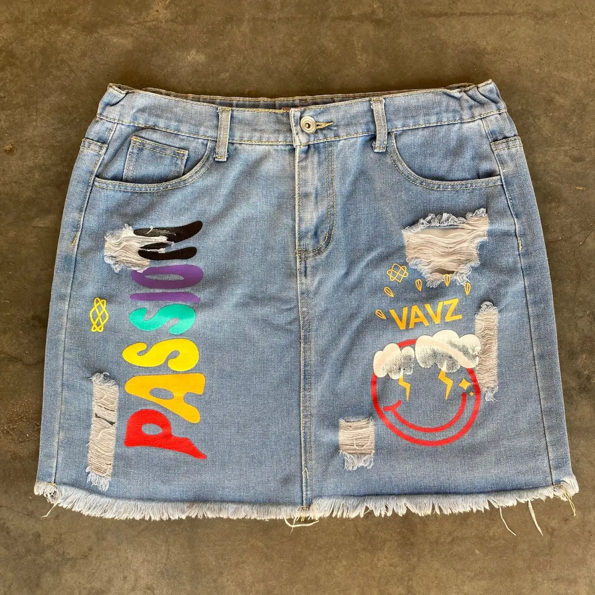 Distressed Denim Skirt with Graphic Print Size 34