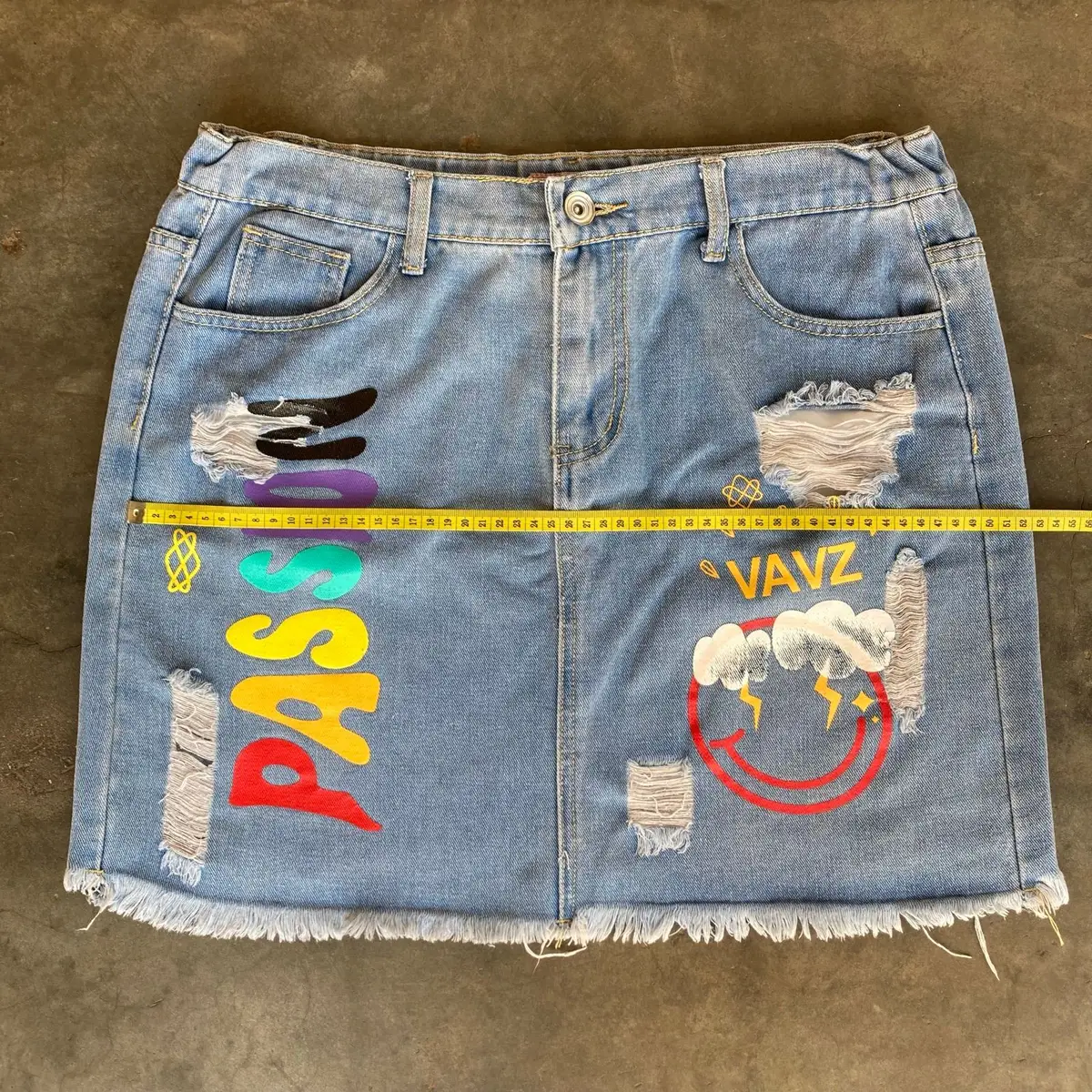 Distressed Denim Skirt with Graphic Print Size 34