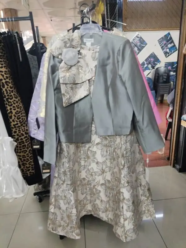 shows a silver-toned, two-piece floral brocade jacket and midi dress set