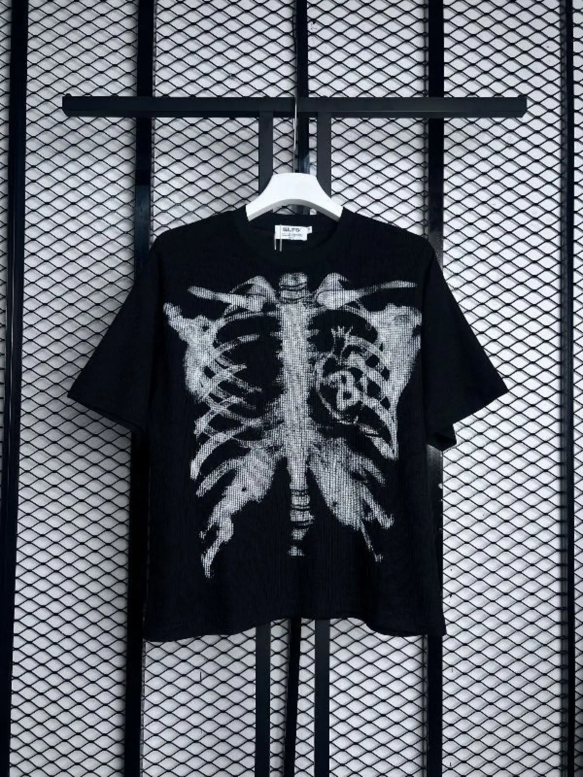 Black Graphic Tee with Skeleton Ribcage Print