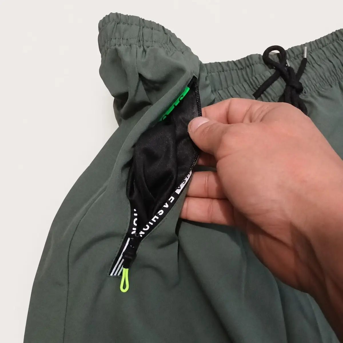 Green Athletic Shorts with Zipper Pockets