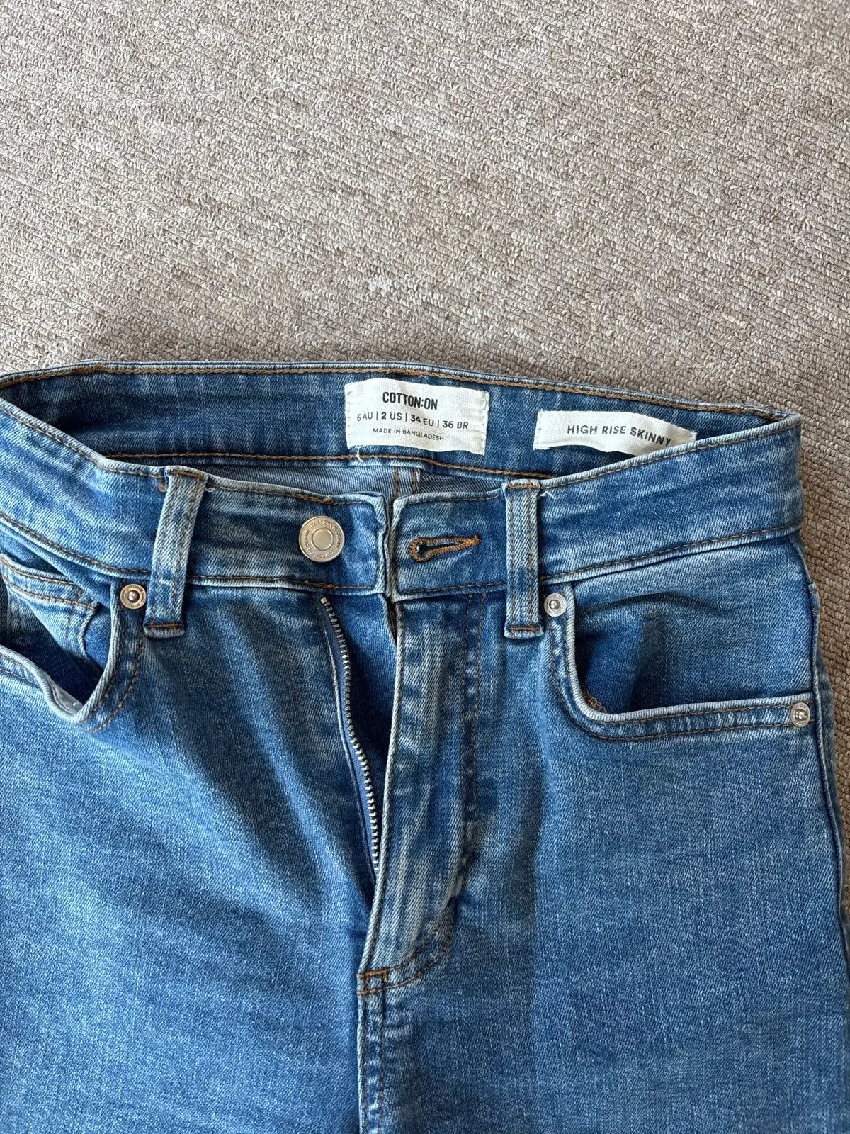 Cotton On White Long-Sleeve Top And Blue Denim Jeans Outfit