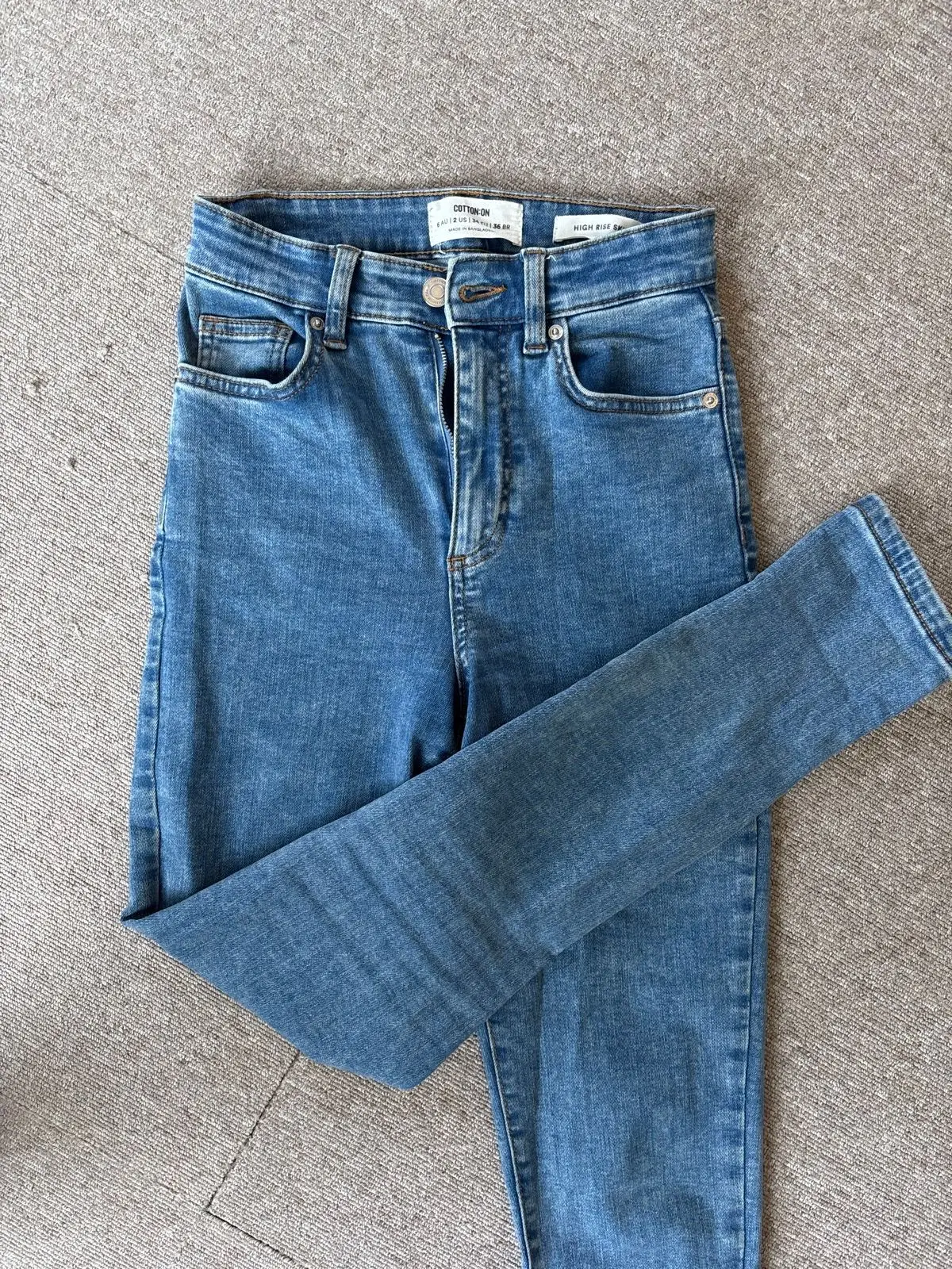 Cotton On White Long-Sleeve Top And Blue Denim Jeans Outfit