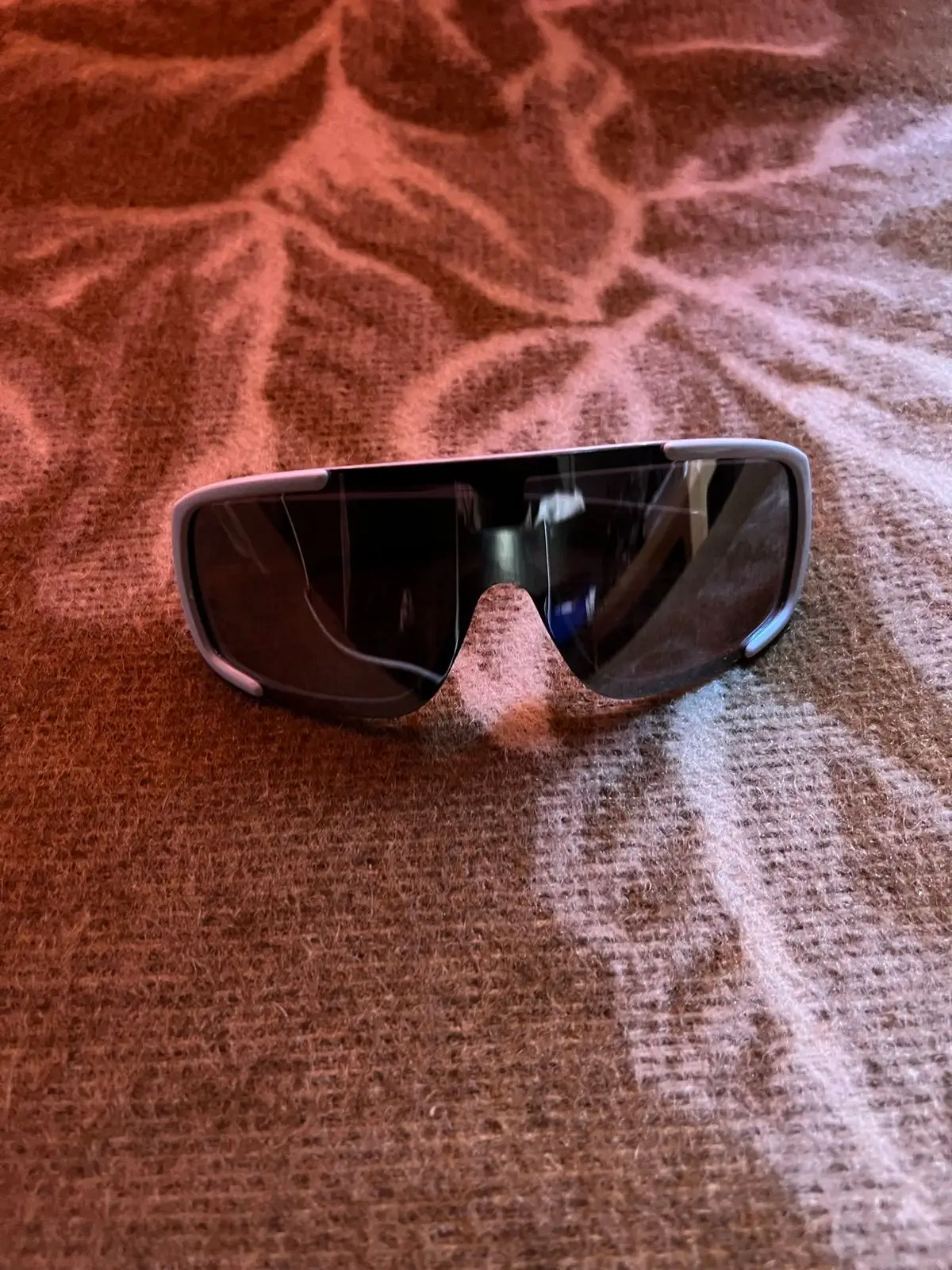 Sunglasses with grey frame and dark lenses