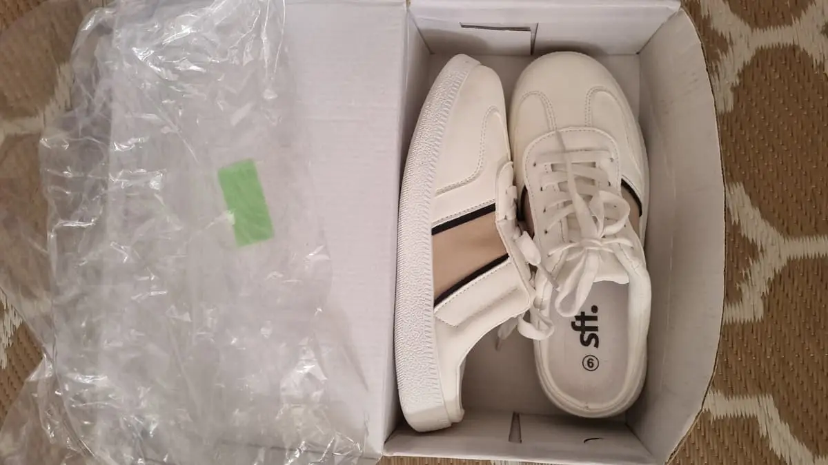 SFT ladies mule-style slip-on sneakers in crisp white with beige and black accent stripes