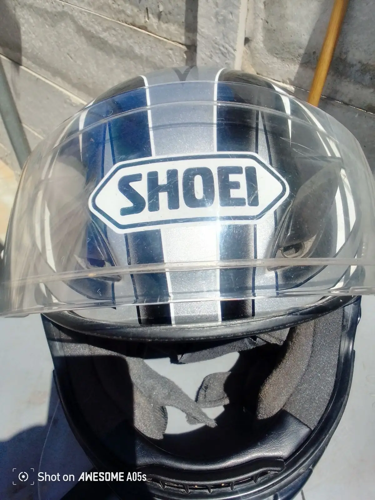 Silver and Black Motorcycle Helmet with Geometric Graphic