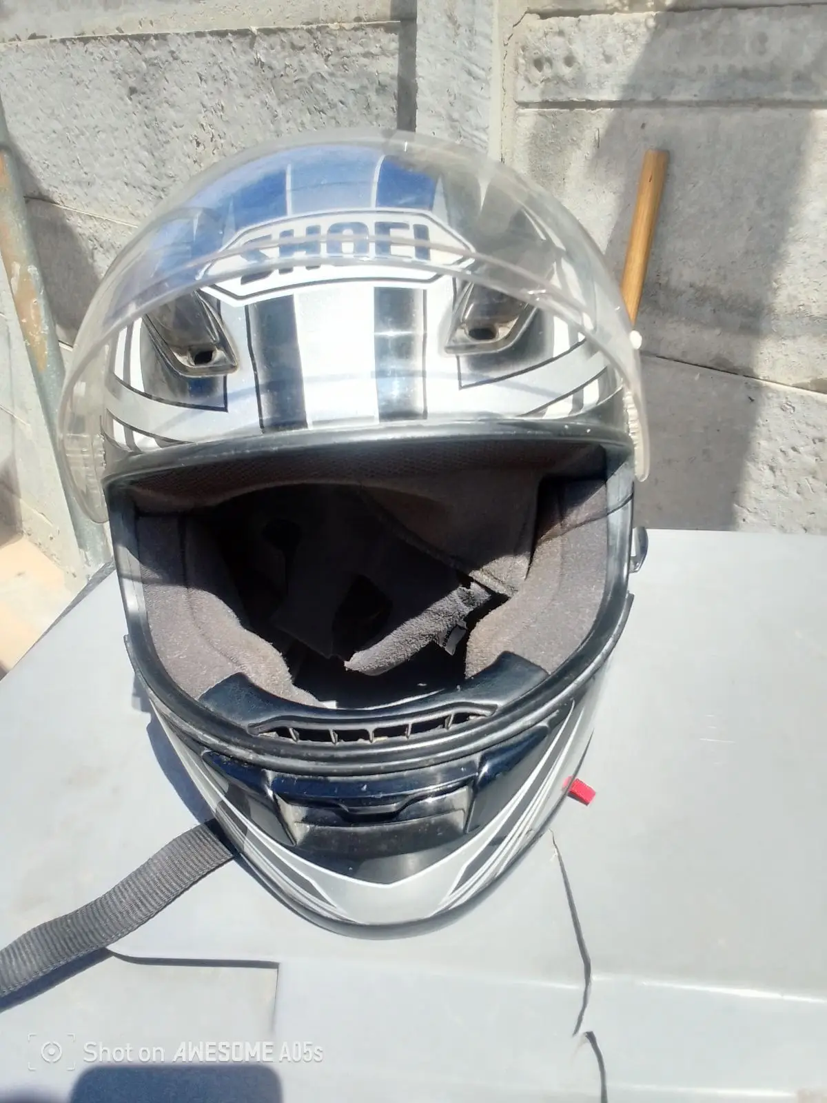 Silver and Black Motorcycle Helmet with Geometric Graphic